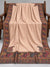 Blush beige Kani shawl with multicolour paisley border displayed open on a studio bench — Taj Mehal Handicrafts