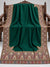 Emerald green Kani shawl with multicolour paisley border displayed open on a studio bench — Taj Mehal Handicrafts