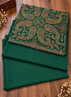 Emerald green multicolor paisley three piece women's suit folded on wooden floor Taj Mehal Handicrafts Islamabad