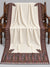 Ivory Kani Moonlight shawl with multicolour paisley border displayed open on a studio bench — Taj Mehal Handicrafts