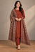 Model wearing a rust unstitched two-piece suit with Moonlight floral paisley shawl