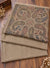 Taupe brown beige multicolor paisley three piece suit folded on wooden floor Taj Mehal Handicrafts Islamabad