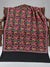 Black shawl with orange and green parrots, pink vines and colourful floral embroidery, displayed on a wooden bench with a plain edge | Taj Mehal Handicrafts