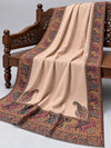 Close view of the blush beige Kani shawl's floral paisley border and corner motifs — Taj Mehal Handicrafts