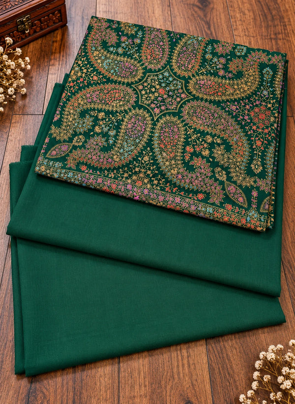 Emerald green multicolor paisley three piece women's suit folded on wooden floor Taj Mehal Handicrafts Islamabad