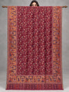 Maroon Moonlight zari Kani Pashmina shawl with birds, floral vines and golden figurative borders, fully open on a wooden rod in a studio | Taj Mehal Handicrafts
