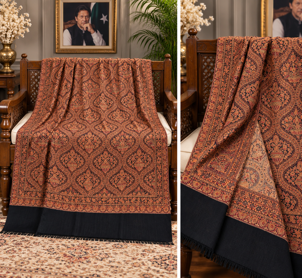 Moonlight Kani reversible Matka design women's shawl displayed on a carved wooden bench, rust brown and black pattern, Taj Mehal Handicrafts Islamabad